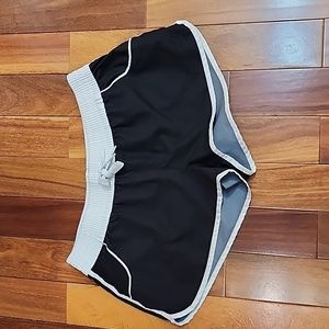 Women's white and black shorts.